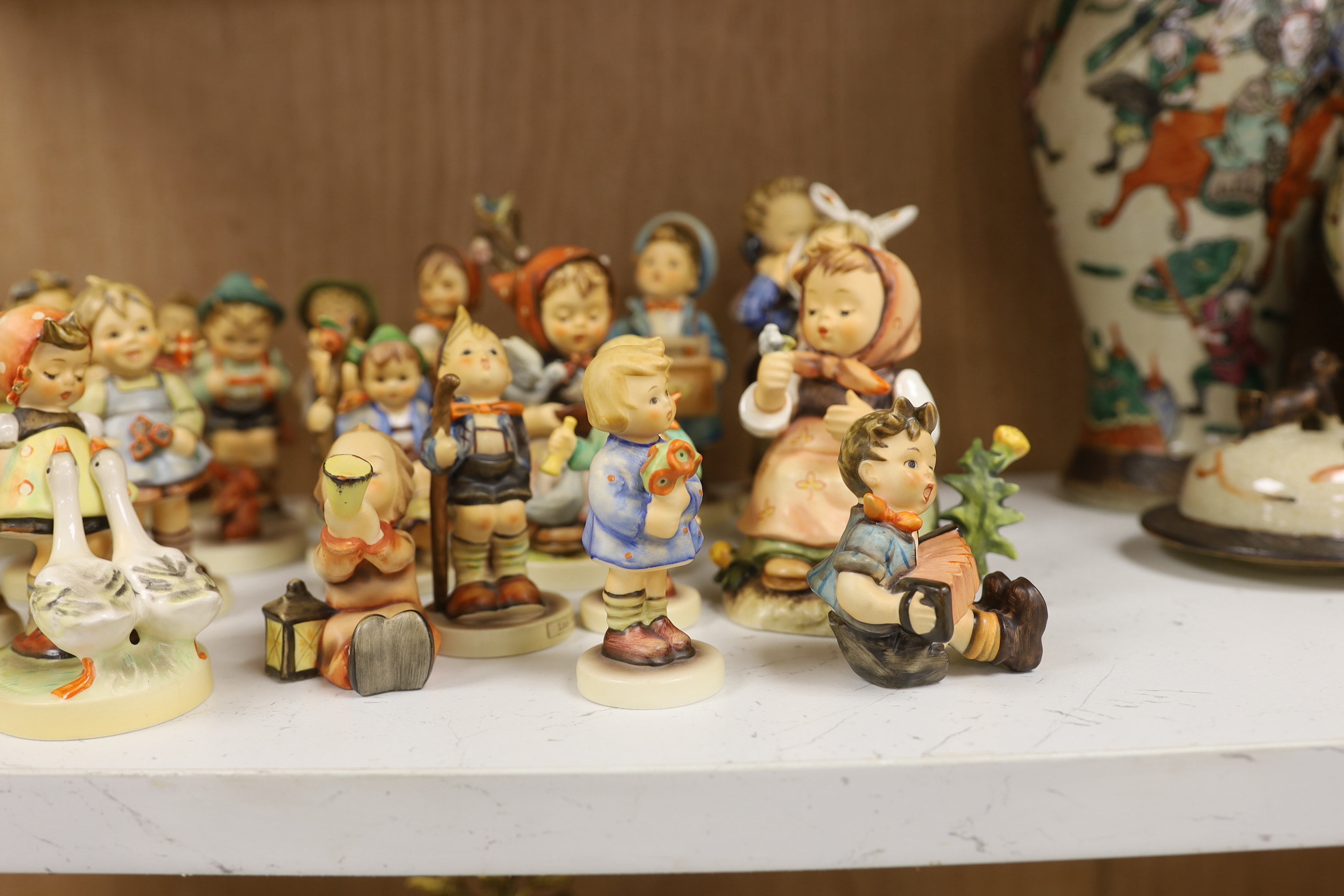 Twenty eight Goebel Hummel figures, largest 15cm high